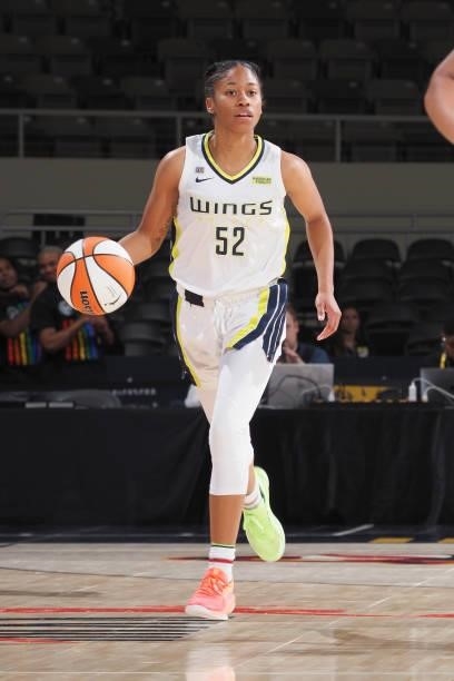 Tyasha Harris of the Dallas Wings dribbles the ball against the Indiana Fever on June 24, 2021 at Indiana Farmers Coliseum in Indianapolis, Indiana....