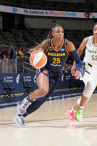 Tiffany Mitchell of the Indiana Fever dribbles the ball against the Dallas Wings on June 24, 2021 at Indiana Farmers Coliseum in Indianapolis,...