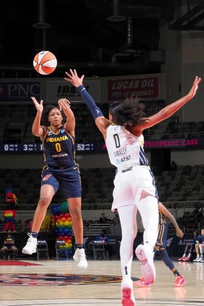 Kelsey Mitchell of the Indiana Fever passes the ball during the game against the Dallas Wings on June 24, 2021 at Indiana Farmers Coliseum in...