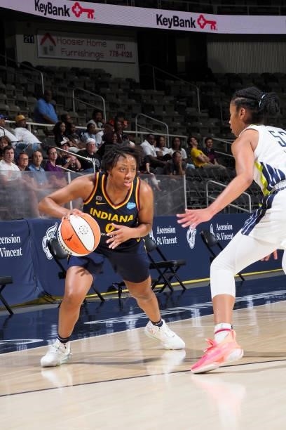 Kelsey Mitchell of the Indiana Fever handles the ball against the Dallas Wings on June 24, 2021 at Indiana Farmers Coliseum in Indianapolis, Indiana....