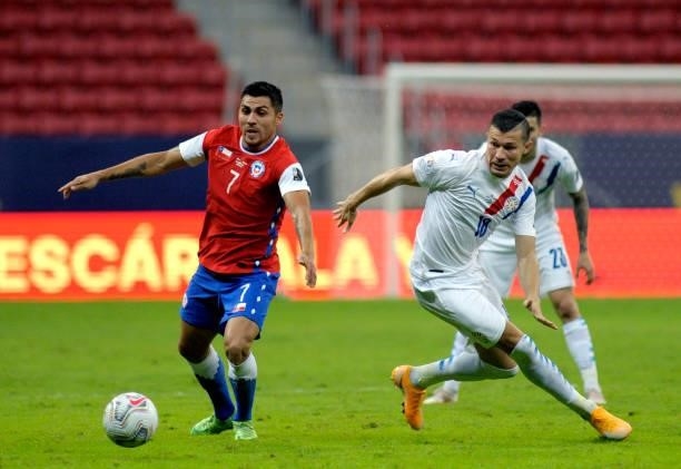 Cesar Pinares of Chile competes for the ball with Braian Samudio of Paraguay during the match between Chile and Paraguay as part of Conmebol Copa...