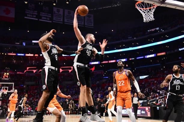 Ivica Zubac of the LA Clippers rebounds the ball during the game against the Phoenix Suns during Game 3 of the Western Conference Finals of the 2021...