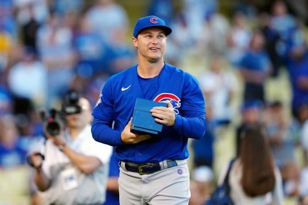 Joc Pederson of the Chicago Cubs being presented with a 2020 World Series before the game between the Chicago Cubs and the Los Angeles Dodgers at...