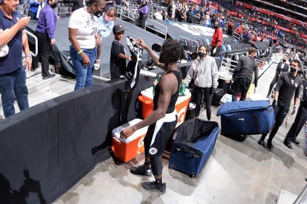 Patrick Beverley of the LA Clippers gives his jersey to fans after the game against the Phoenix Suns during Game 3 of the Western Conference Finals...