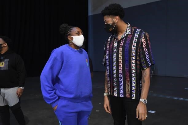 Nneka Ogwumike of the Los Angeles Sparks talks with Anthony Davis of the Los Angeles Lakers during the game between the Los Angeles Sparks and the...