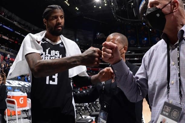 Paul George of the LA Clippers high fives owner, Steve Ballmer of the LA Clippers after the game against the Phoenix Suns during Game 3 of the...