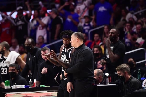 Patrick Beverley of the LA Clippers talks to Head Coach Tyronn Lue of the Los Angeles Clippers during the game against the Phoenix Suns during Game 3...