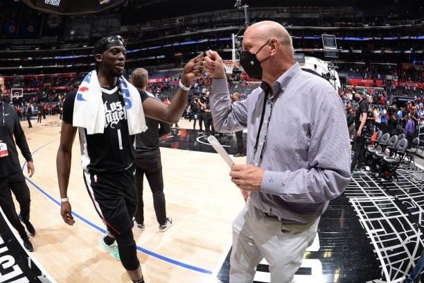 Reggie Jackson of the LA Clippers high fives owner, Steve Ballmer of the LA Clippers after the game against the Phoenix Suns during Game 3 of the...