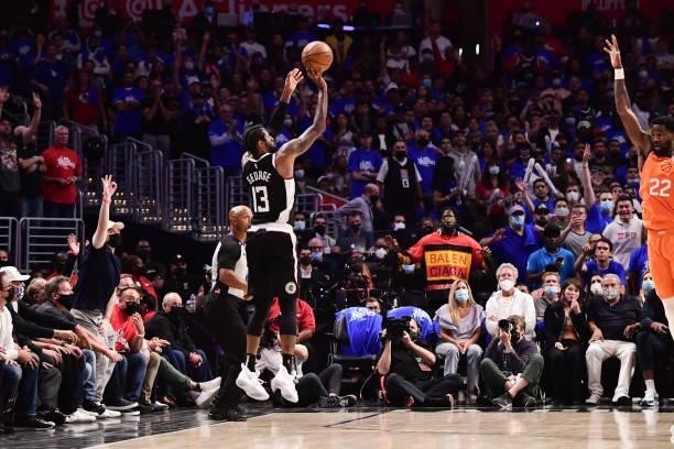 Paul George of the LA Clippers shoots a three point basket during the game against the Phoenix Suns during Game 3 of the Western Conference Finals of...