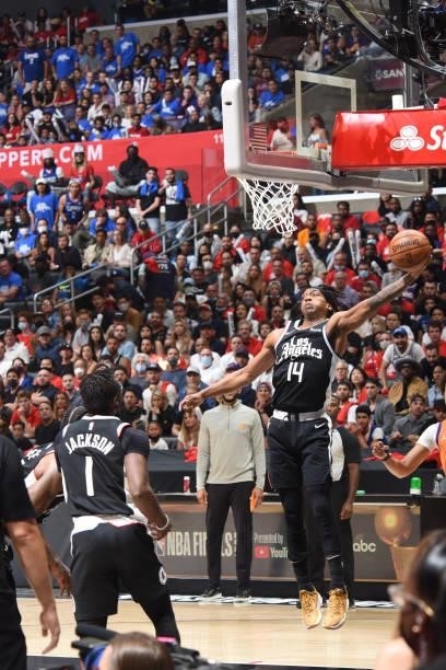 Terance Mann of the LA Clippers rebounds the ball against the Phoenix Suns during Game 3 of the Western Conference Finals of the 2021 NBA Playoffs on...