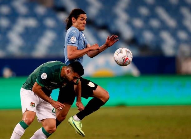 Edinson Cavani of Uruguay competes for the ball with Danny Bejarano of Bolivia ,during the match between Bolivia and Uruguay as part of Conmebol Copa...