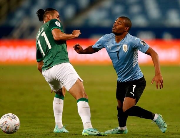 Nicolas De La Cruz of Uruguay competes for the ball with Rodrigo Luis Ramallo of Bolivia ,during the match between Bolivia and Uruguay as part of...