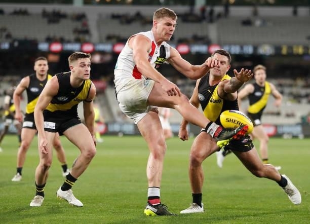 Mason Wood of the Saints and Jack Graham of the Tigers in action during the 2021 AFL Round 15 match between the Richmond Tigers and the St Kilda...