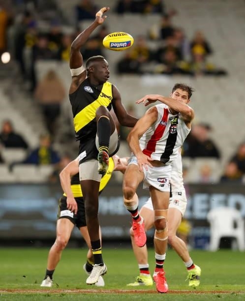 Mabior Chol of the Tigers and Paddy Ryder of the Saints compete in a ruck contest during the 2021 AFL Round 15 match between the Richmond Tigers and...