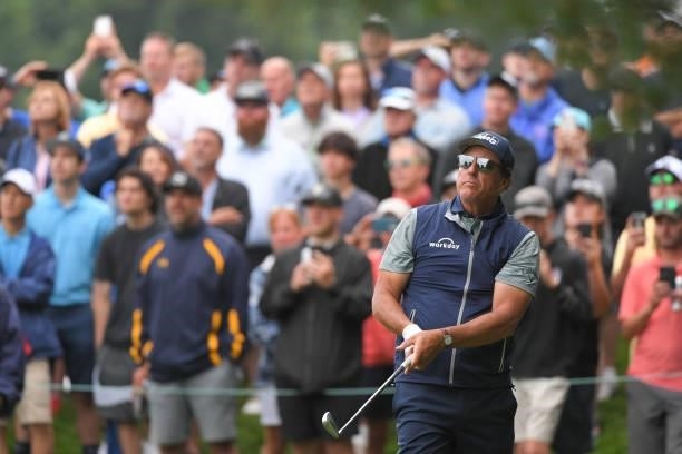 Phil Mickelson watches his tee shot on the eighth hole during the second round of the Travelers Championship at TPC River Highlands on June 25, 2021...
