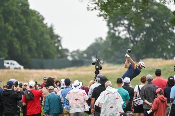 Dustin Johnson swings over his ball on the second tee box during the second round of the Travelers Championship at TPC River Highlands on June 25,...