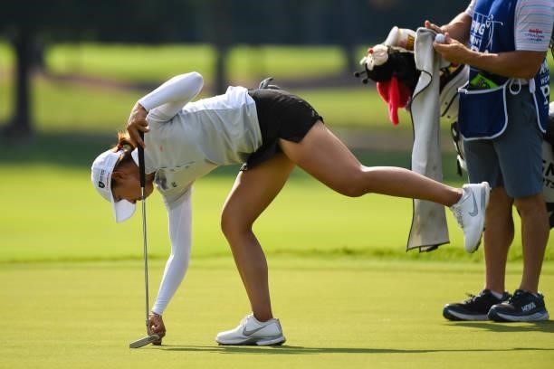 Tiffany Chan of Hong Kong marks her spot on the eighth hole during the second round for the 2021 KPMG Women's Championship at the Atlanta Athletic...
