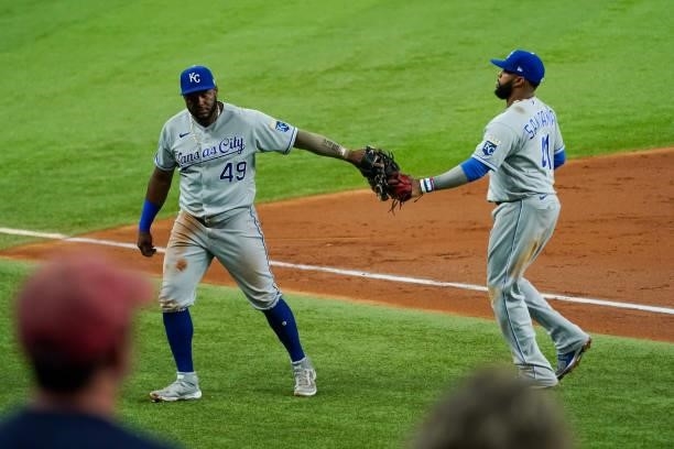 Hanser Alberto of the Kansas City Royals celebrates a successful throw to first with Carlos Santana of the Kansas City Royals in the 2nd inning of...