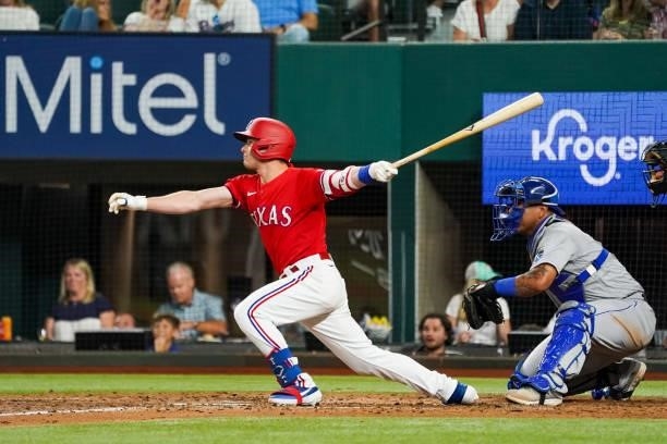 Nick Solak of the Texas Rangers hits Arun scoring single in the bottom of the 6th inning of the game against the Kansas City Royals at Globe Life...