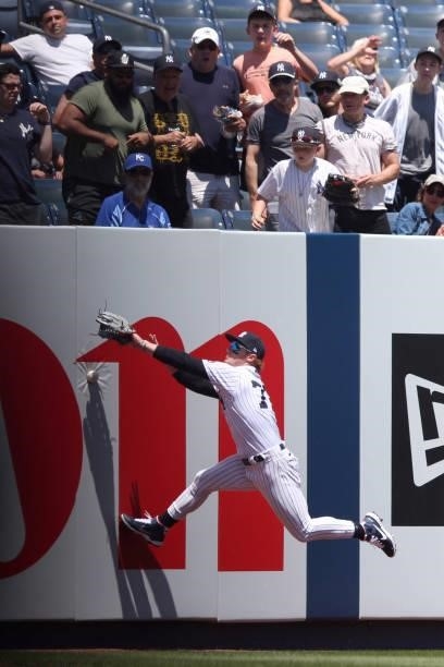 Clint Frazier of the New York Yankees fails to make a catch during the game between the Kansas City Royals and the New York Yankees at Yankee Stadium...