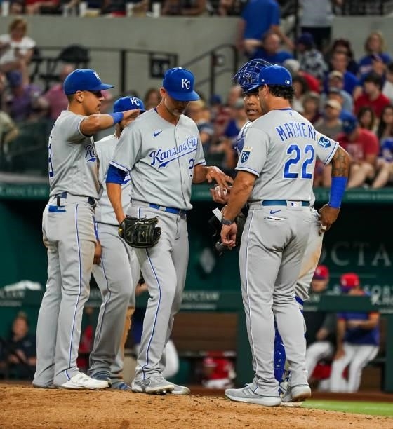 Mike Minor of the Kansas City Royals gives the ball to manager Mike Matheny as he leaves the game in the bottom of the 6th inning of the game against...