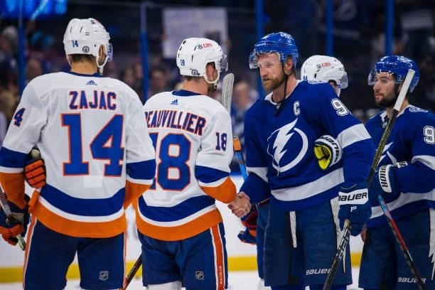 Steven Stamkos of the Tampa Bay Lightning shakes hands with Anthony Beauvillier of the New York Islanders after the series win in Game Seven of the...