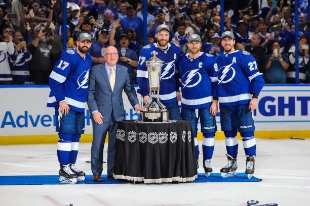 Alex Killorn, Victor Hedman, Steven Stamkos, and Ryan McDonagh of the Tampa Bay Lightning pose with Deputy Commissioner Bill Daily and the Prince of...