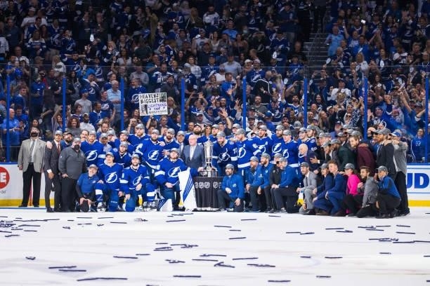 The Tampa Bay Lightning pose with Deputy Commissioner Bill Daily and the Prince of Wales Trophy after the game and series win against the New York...