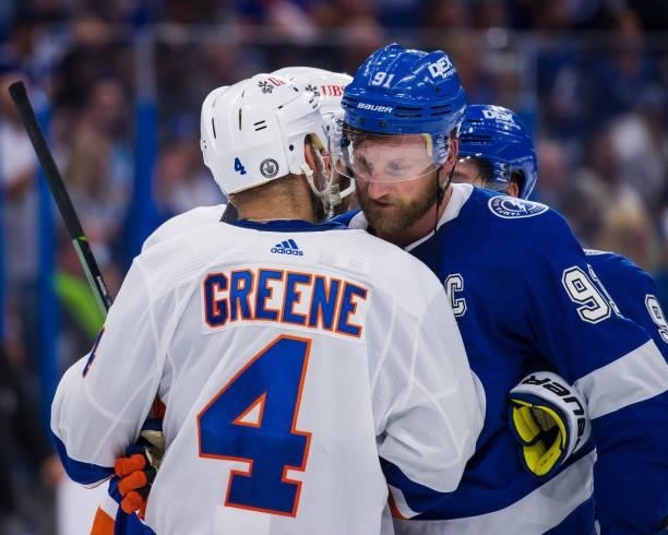 Steven Stamkos of the Tampa Bay Lightning shakes hands with Andy Greene of the New York Islanders after the series win in Game Seven of the Stanley...