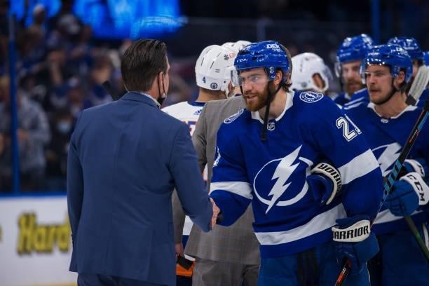Brayden Point of the Tampa Bay Lightning shakes hands with the New York Islanders after the series win in Game Seven of the Stanley Cup Semifinals of...