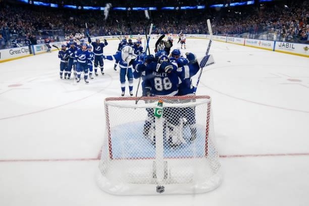 The Tampa Bay Lightning celebrate the game and series win against the New York Islanders in Game Seven of the Stanley Cup Semifinals of the 2021...