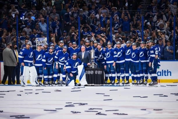 The Tampa Bay Lightning pose with Deputy Commissioner Bill Daily and the Prince of Wales Trophy after the game and series win against the New York...