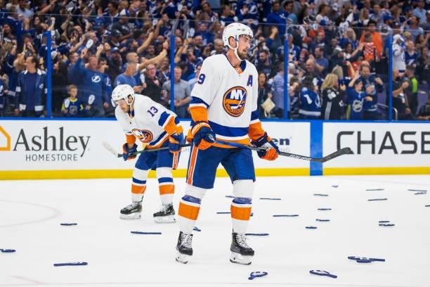 Mathew Barzal and Brock Nelson of the New York Islanders react to the loss in Game Seven of the Stanley Cup Semifinals of the 2021 Stanley Cup...