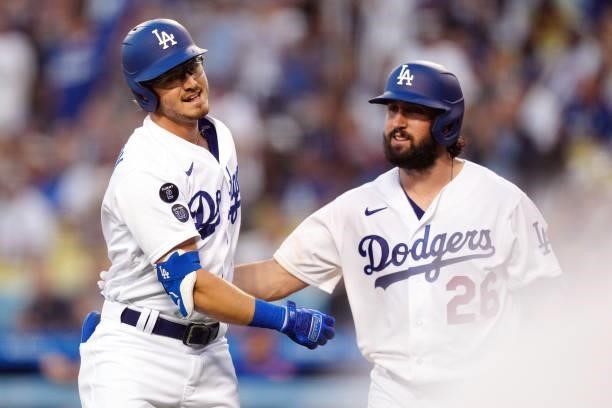 Zach McKinstry of the Los Angeles Dodgers celebrates with Tony Gonsolin after hitting a home run during the game between the Chicago Cubs and the Los...