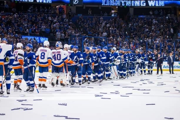 The Tampa Bay Lightning shakes hands with the New York Islanders after the series win in Game Seven of the Stanley Cup Semifinals of the 2021 Stanley...