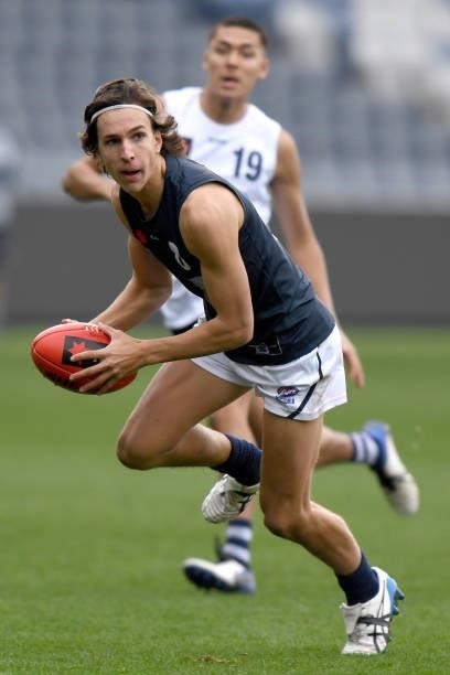 Darcy Edmends of Vic Metro runs with the ball during the U17 Championships match between Vic Country and Vic Metro at GMHBA Stadium on June 26, 2021...
