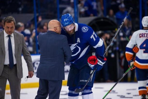 Victor Hedman of the Tampa Bay Lightning shakes hands with Head Coach Barry Trotz of the New York Islanders after the series win in Game Seven of the...