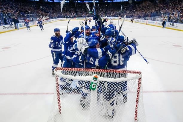 The Tampa Bay Lightning celebrate the game and series win against the New York Islanders in Game Seven of the Stanley Cup Semifinals of the 2021...