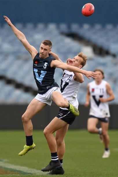 Kai Windsor of Vic Metro and Vincent Huf of Vic Country jump for the ball during the U17 Championships match between Vic Country and Vic Metro at...