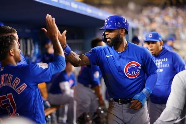 Jason Heyward of the Chicago Cubs celebrates with Sergio Alcántara after tying the game during the game between the Chicago Cubs and the Los Angeles...