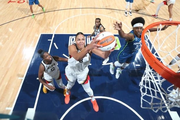 Liz Cambage of the Las Vegas Aces grabs the rebound against the Minnesota Lynx on June 25, 2021 at Target Center in Minneapolis, Minnesota. NOTE TO...