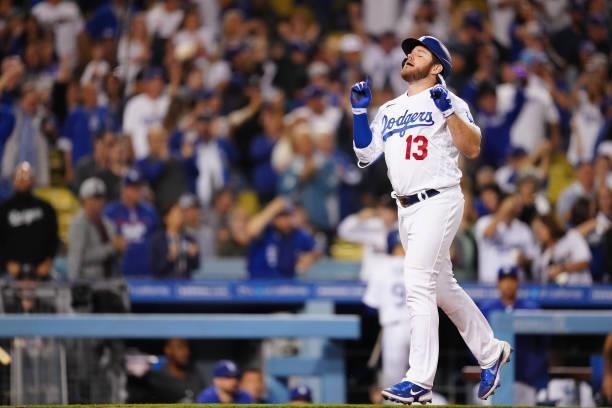 Max Muncy of the Los Angeles Dodgers celebrates after hitting a home run during the game between the Chicago Cubs and the Los Angeles Dodgers at...