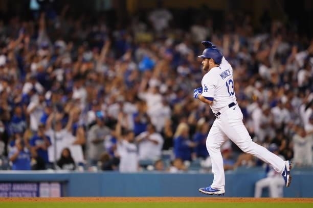 Max Muncy of the Los Angeles Dodgers celebrates after hitting a home run during the game between the Chicago Cubs and the Los Angeles Dodgers at...