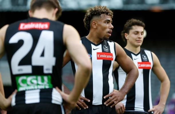 Isaac Quaynor of the Magpies looks dejected after a loss during the 2021 AFL Round 15 match between the Collingwood Magpies and the Fremantle Dockers...
