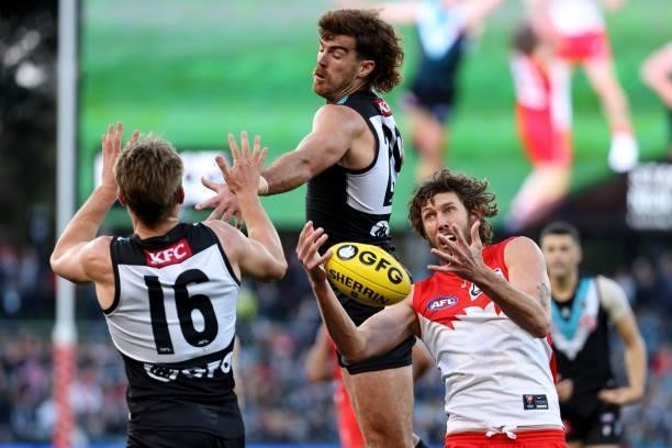 Scott Lycett of the Power clashes with Tom Hickey of the Swans during the 2021 AFL Round 15 match between the Port Adelaide Power and the Sydney...