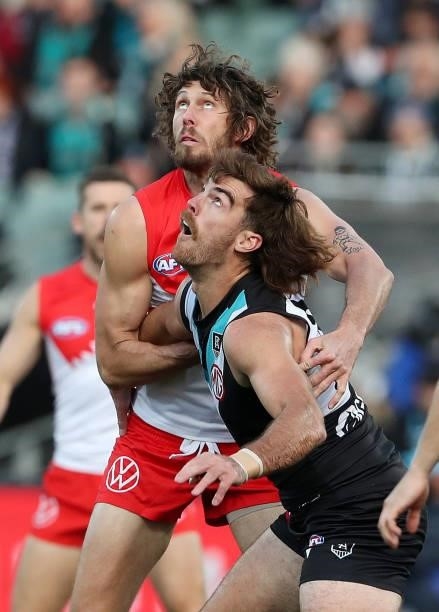 Scott Lycett of the Power and Tom Hickey of the Swans during the 2021 AFL Round 15 match between the Port Adelaide Power and the Sydney Swans at...