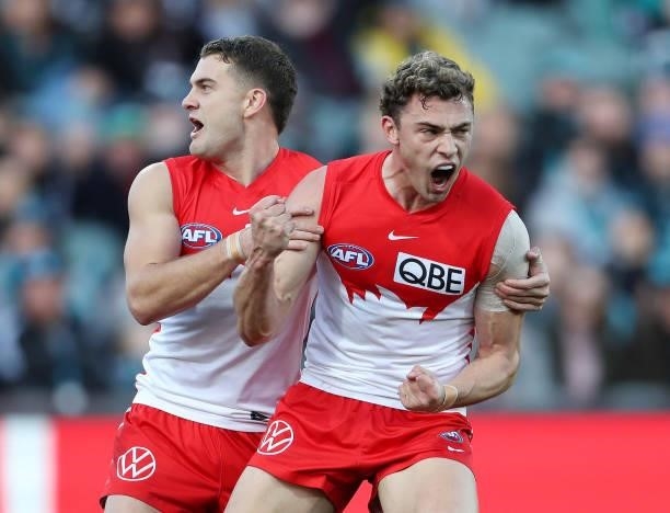 Will Hayward of the Swans celebrates a goal with Tom Papley during the 2021 AFL Round 15 match between the Port Adelaide Power and the Sydney Swans...