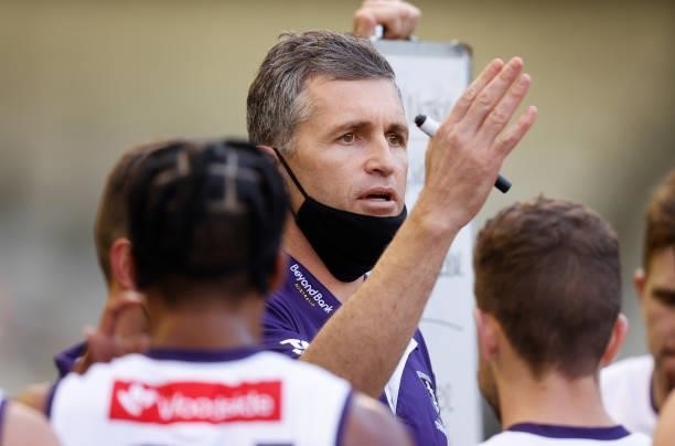Justin Longmuir, Senior Coach of the Dockers addresses his players during the 2021 AFL Round 15 match between the Collingwood Magpies and the...