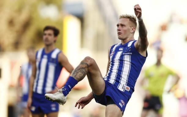 Jaidyn Stephenson of the Kangaroos kicks the ball during the 2021 AFL Round 15 match between the North Melbourne Kangaroos and the Gold Coast Suns at...
