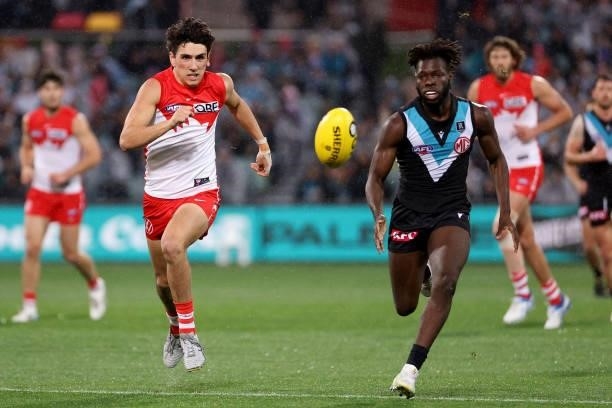 Justin McInerney of the Swans competes with Martin Frederick of the Power during the 2021 AFL Round 15 match between the Port Adelaide Power and the...